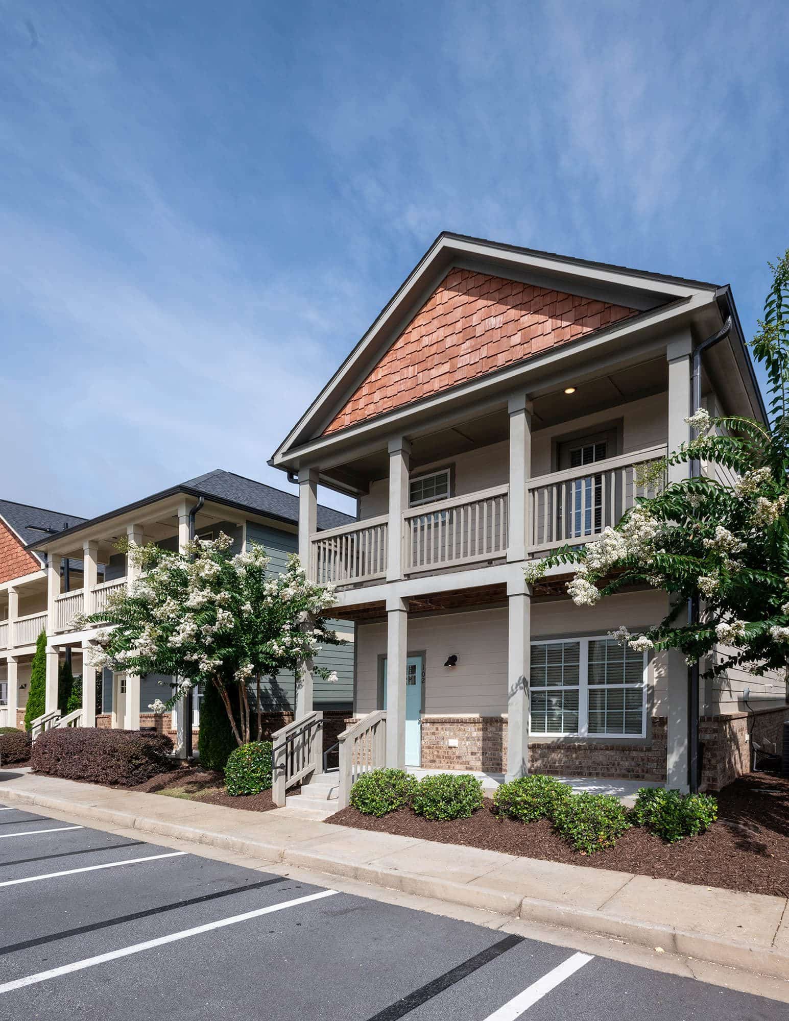 the-collective-at-kennesaw-apartments-near-ksu-2-story-cottages-exterior-with-landscaping-rotated